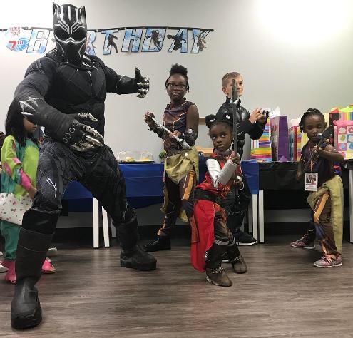 This is an A+ picture with some dedicated heroes with this superhero for Houston area birthday parties.