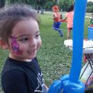 Rent an artist to do face painting and balloon animals at your next houston birthday party. This little girl in Jersey Village had a Poopy Troll painted and a balloon sword made.