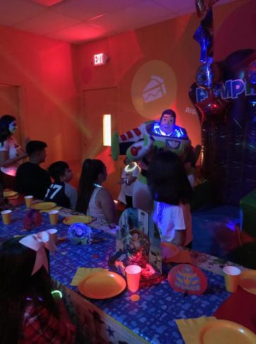 Rent our toy astronaut mascot superhero with cool lights and buttons for birthday parties like this on at pump it up in Sugarland