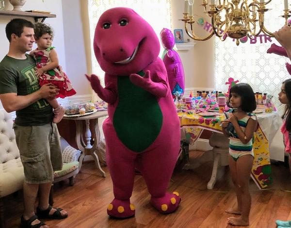 Hire our fun purple dinosaur for your childs birthday party in Houston with songs, games, & dancing.